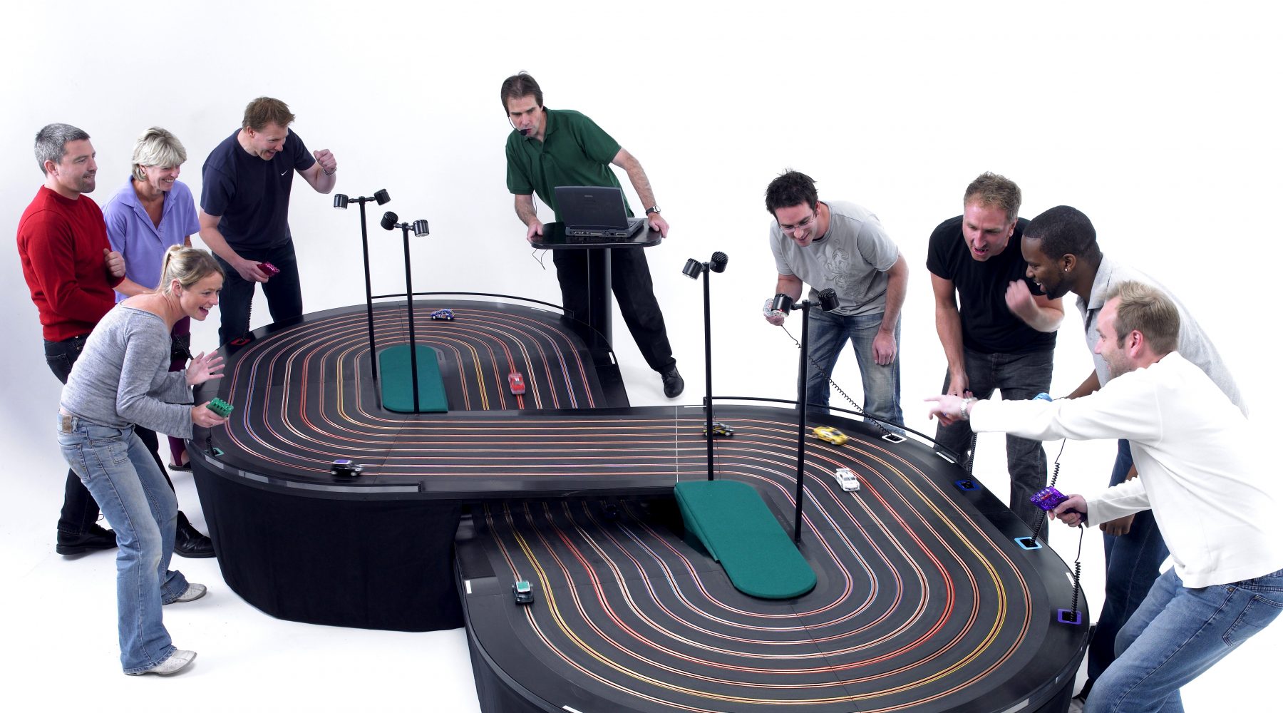 miniracing.com giant 8 lane scalextric track being used in a competition at an event